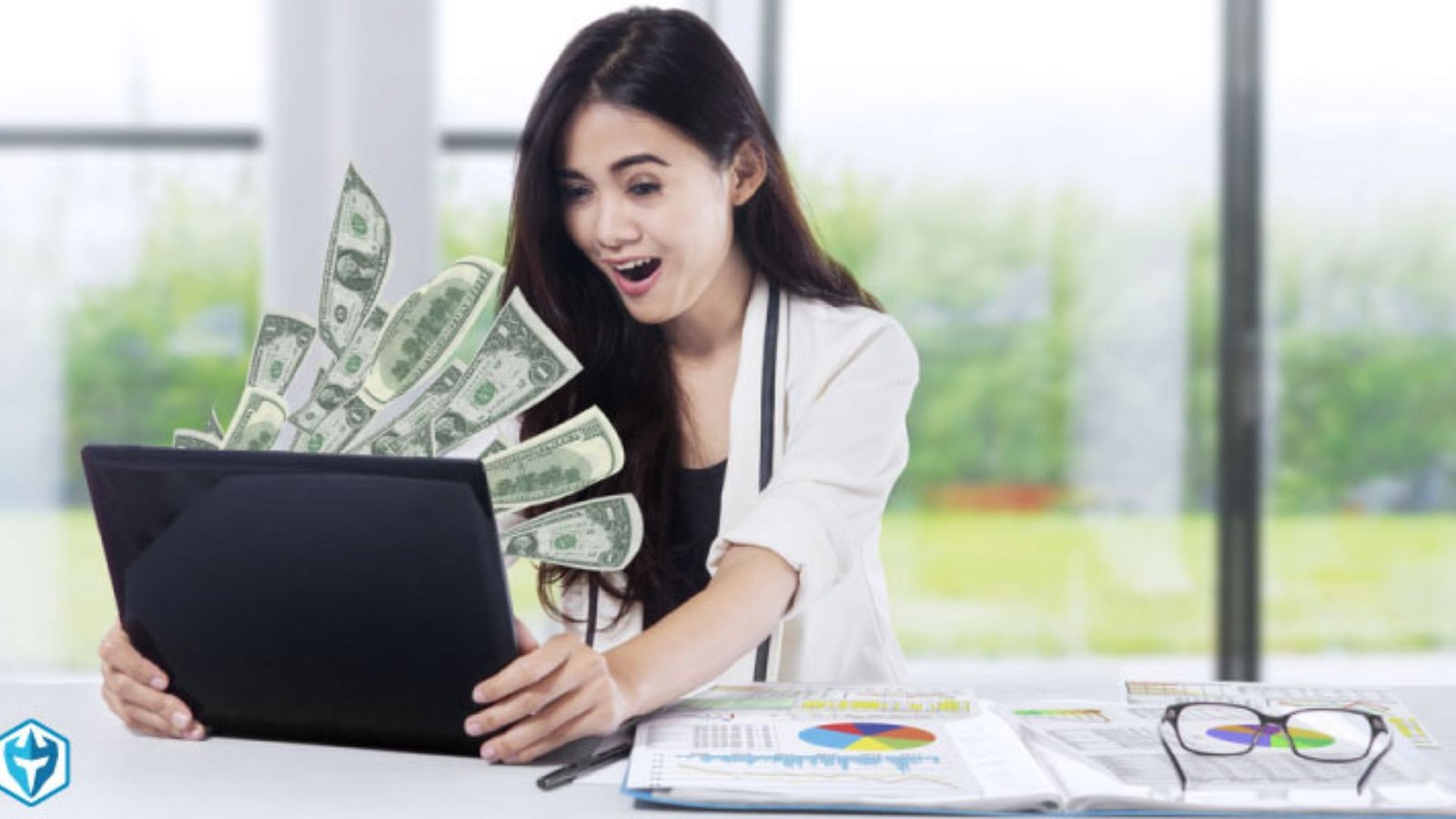 a lady looking happy with a laptop and money showing how trading makes money
